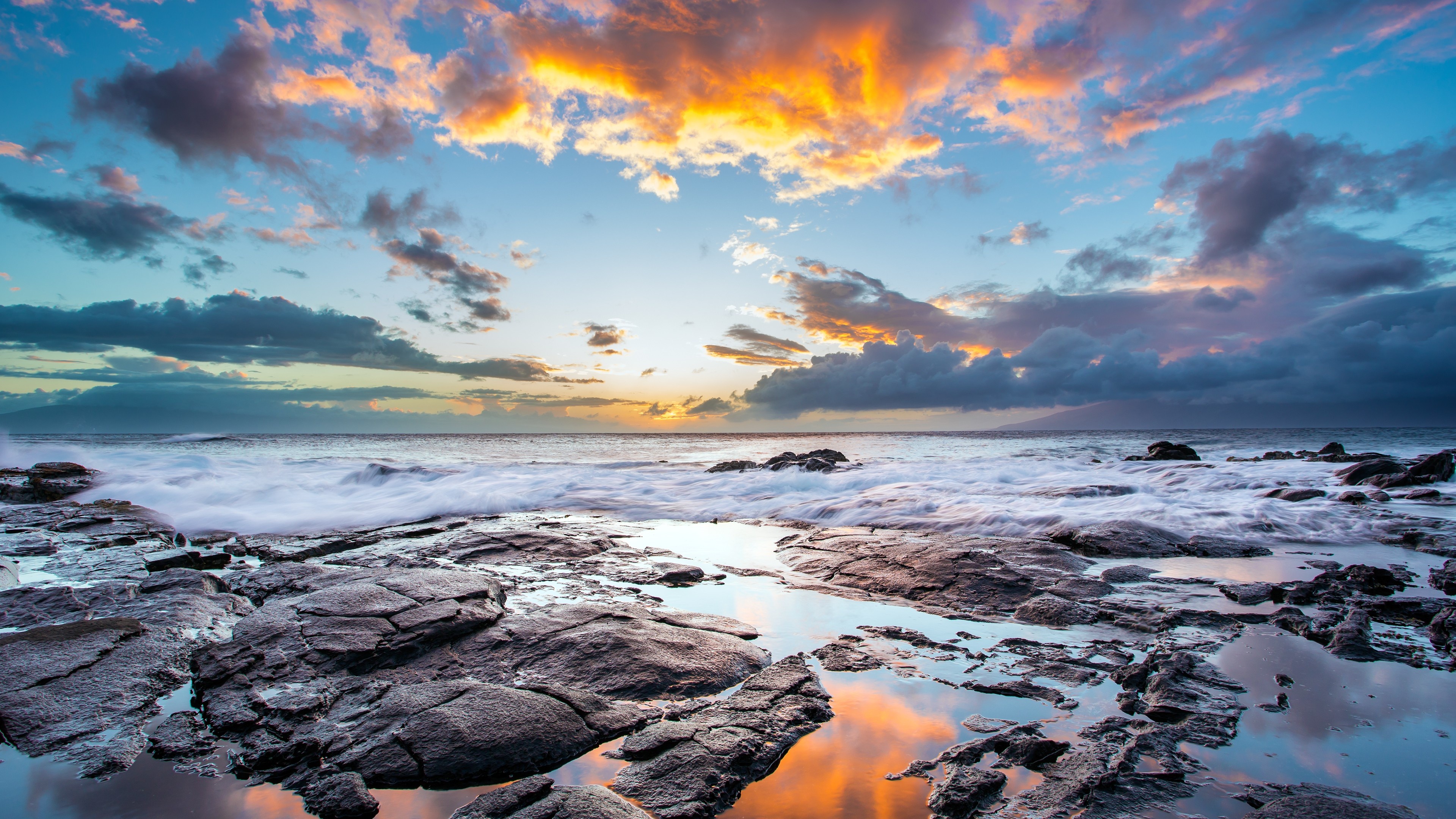 volcanic rock tide pool, crashing ocean surf, golden sunset sky, 4K Desktop wallpaper