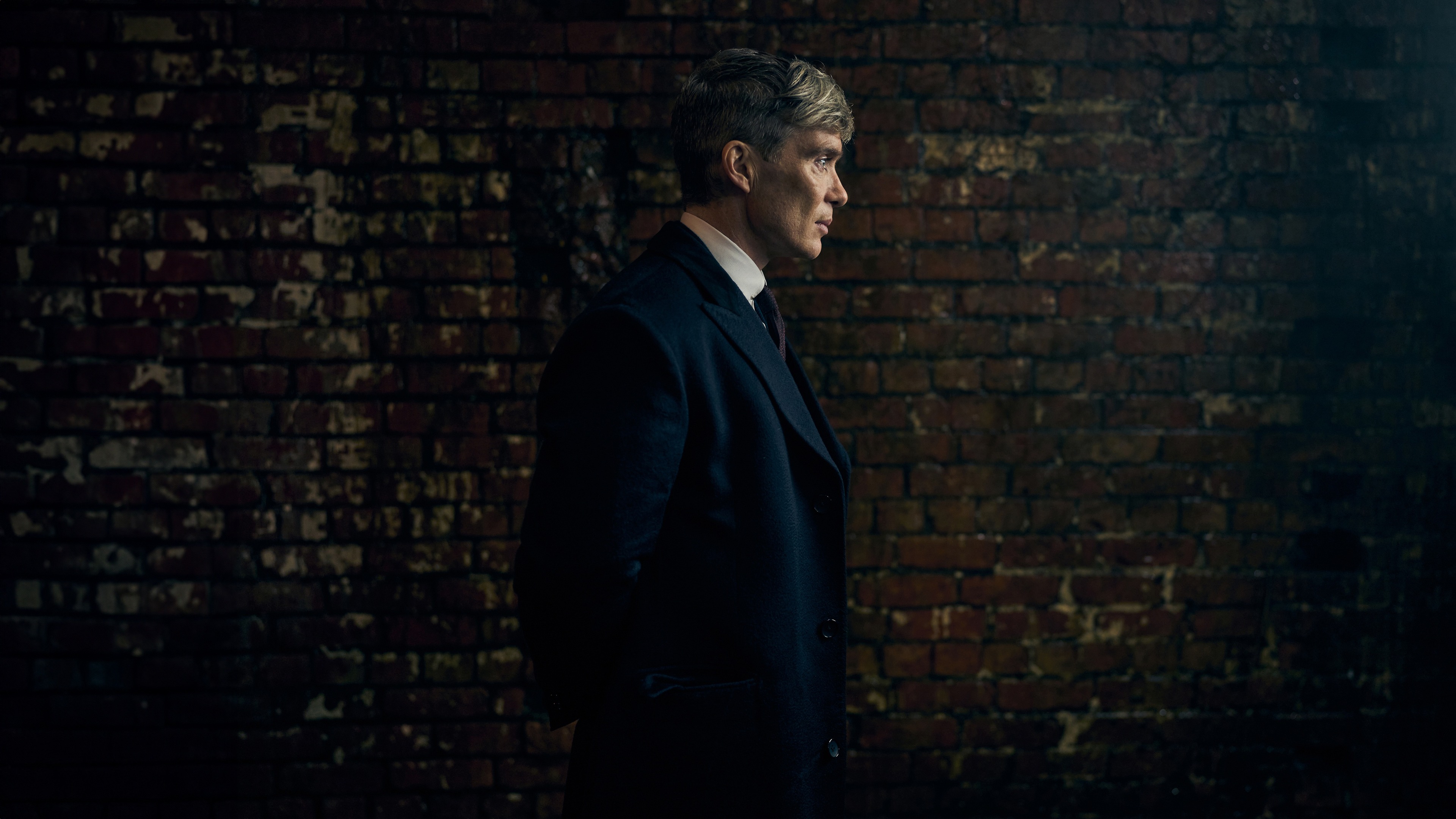 Thomas Shelby, Weathered brick wall, Dim industrial interior, 4K Desktop wallpaper