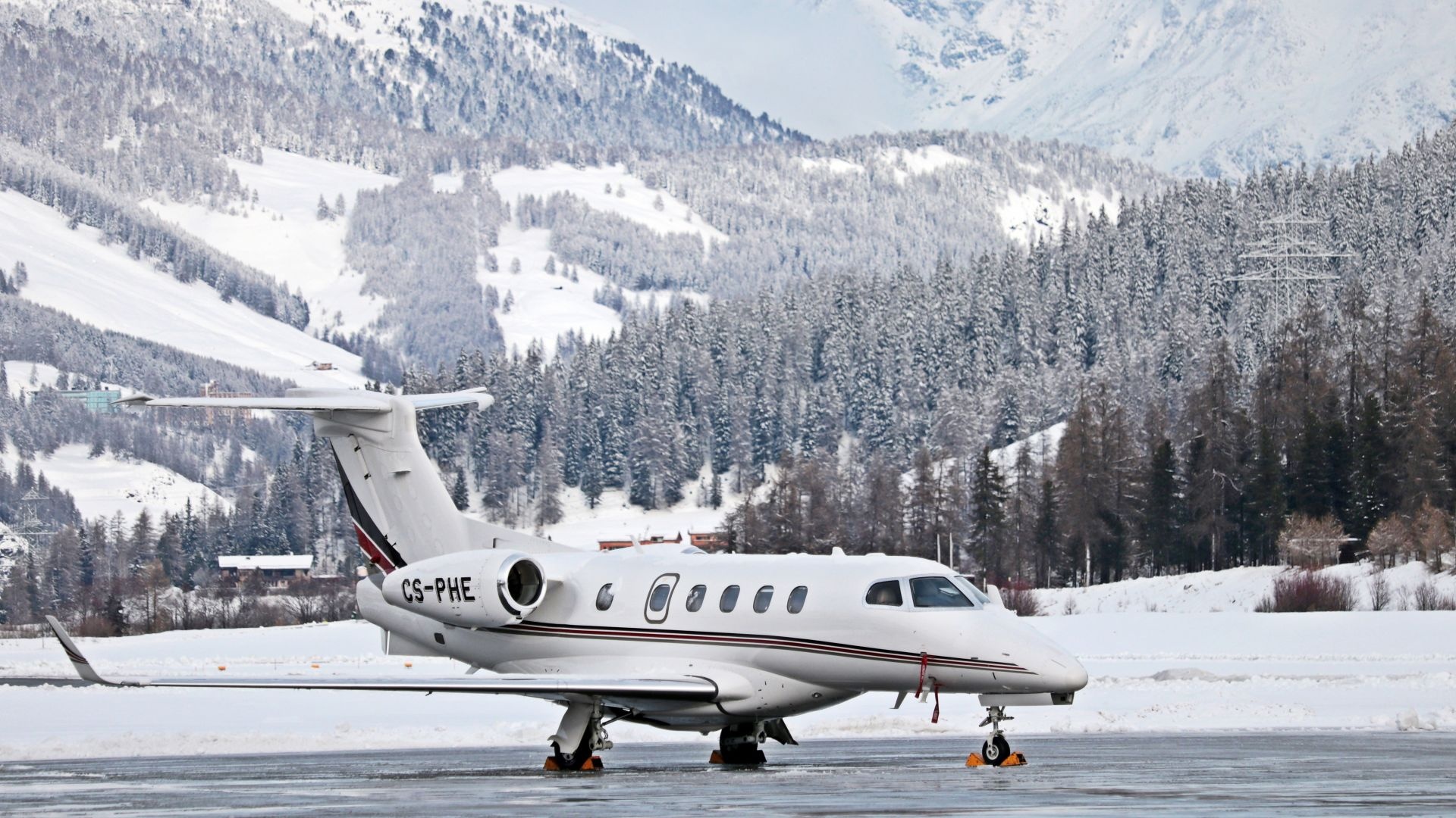 Embraer Phenom 300, Snowy airport runway, Snow-covered Alpine mountains, Full HD Desktop wallpaper