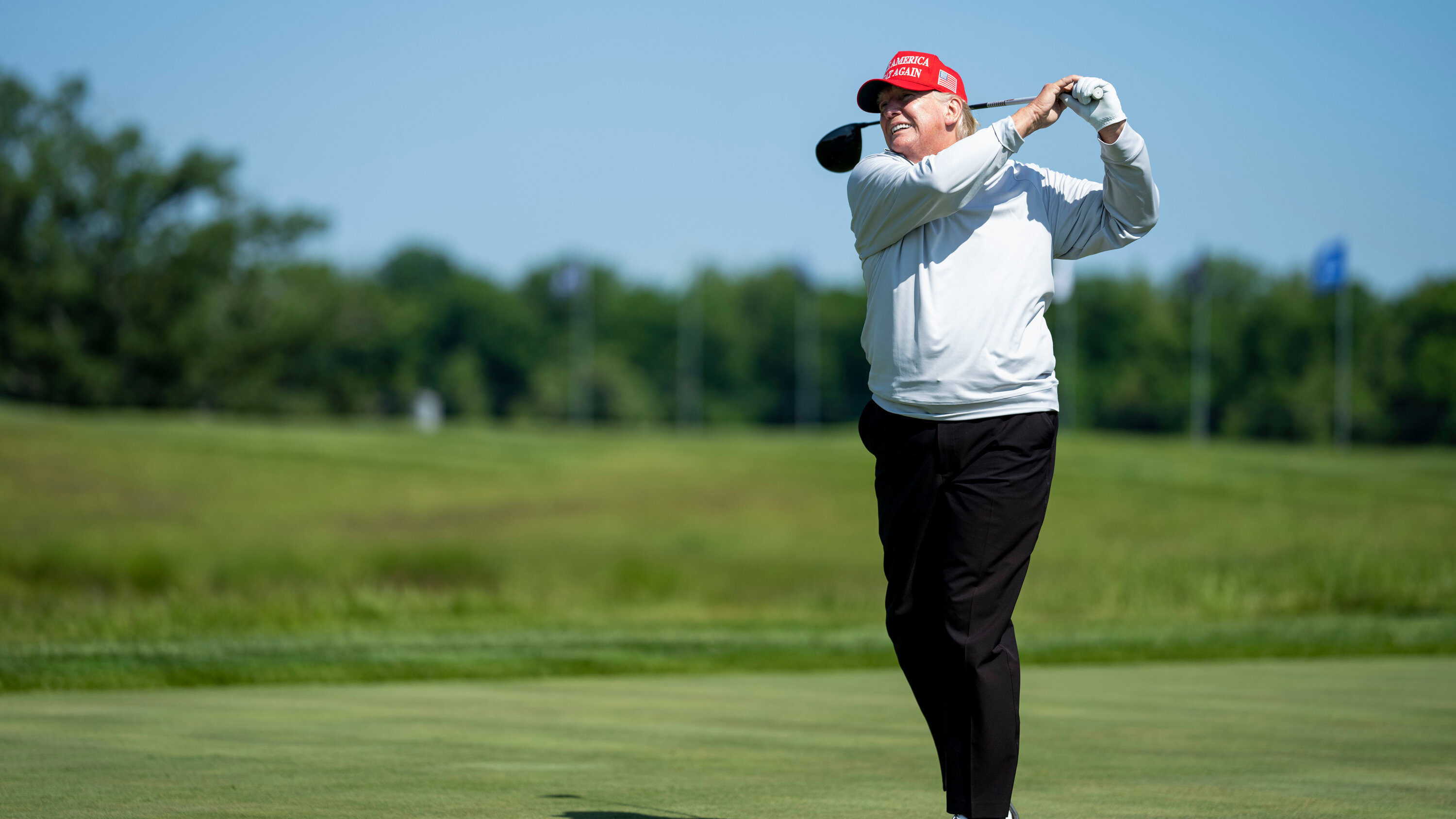 Donald Trump, red MAGA cap, golf swing follow-through, HD Desktop wallpaper