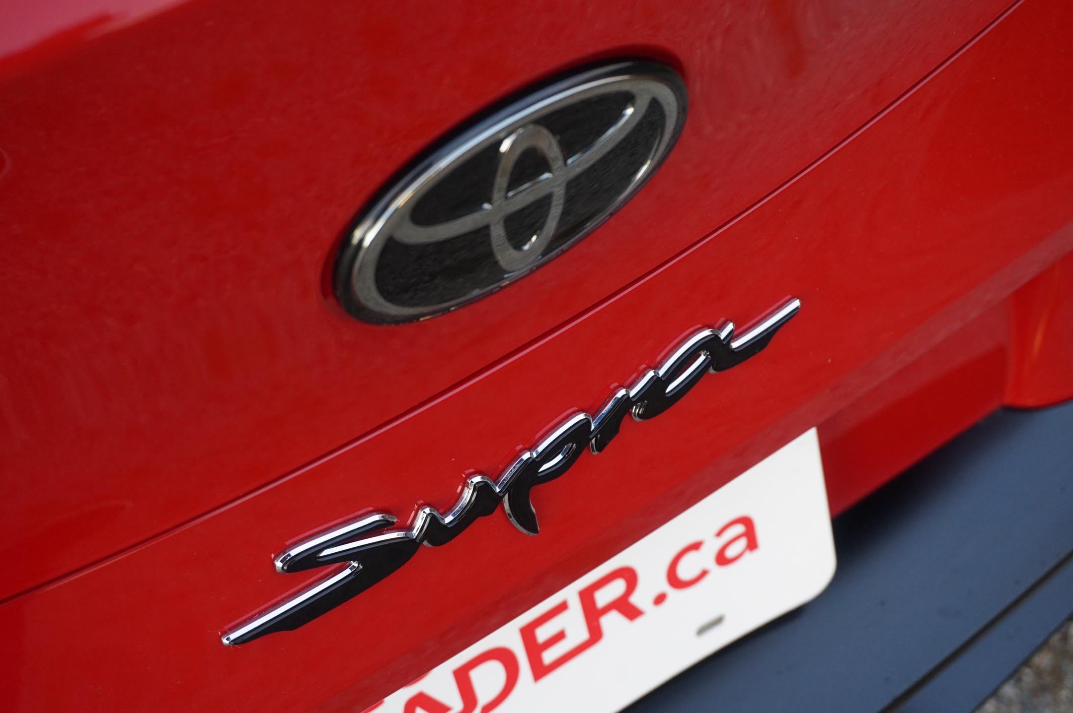 Toyota Supra chrome badge, Toyota oval logo emblem, Glossy red car body, HD Desktop wallpaper