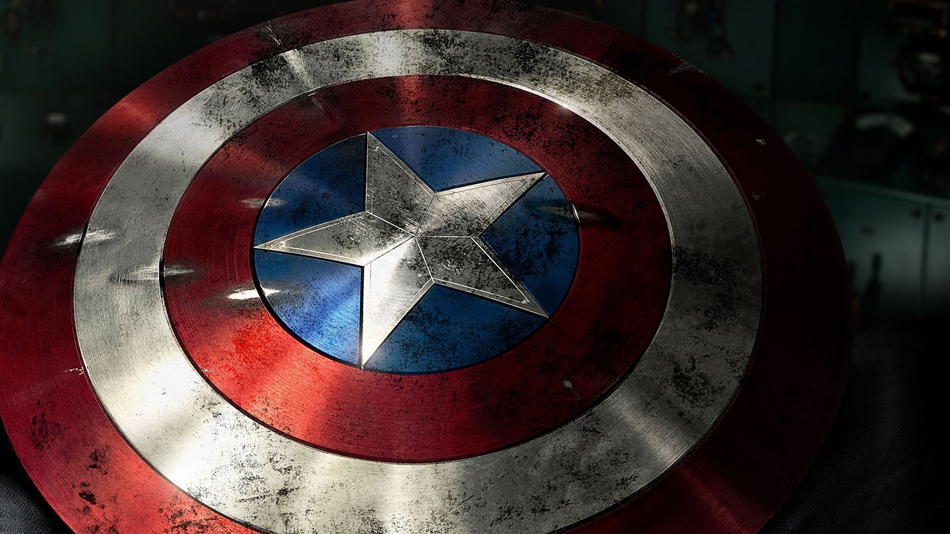 Captain America vibranium shield, central silver star, battle-damaged brushed metal, Full HD Desktop wallpaper
