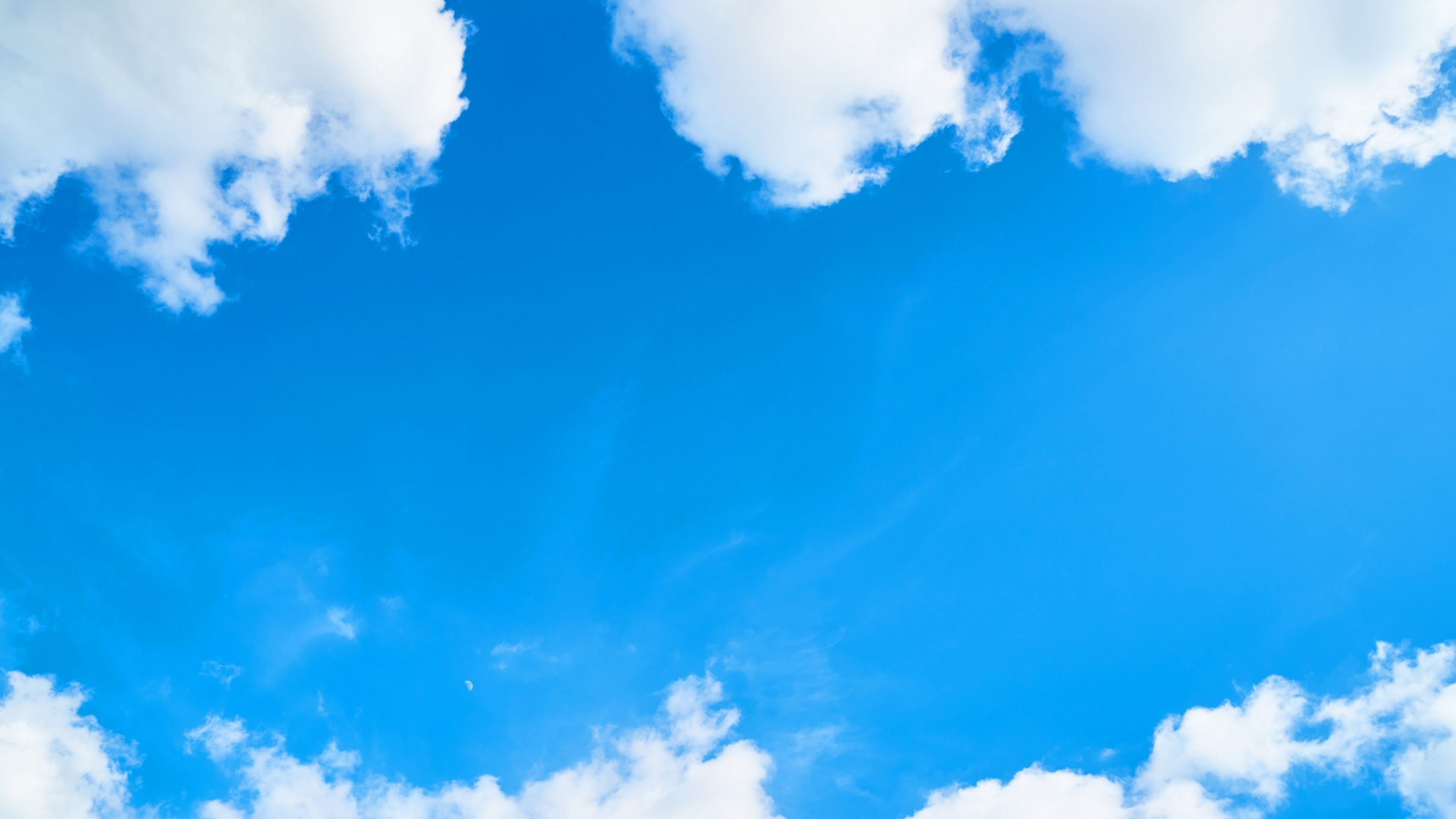 Fluffy white cumulus clouds, Bright azure daytime sky, Faint daytime crescent moon, 4K Desktop wallpaper