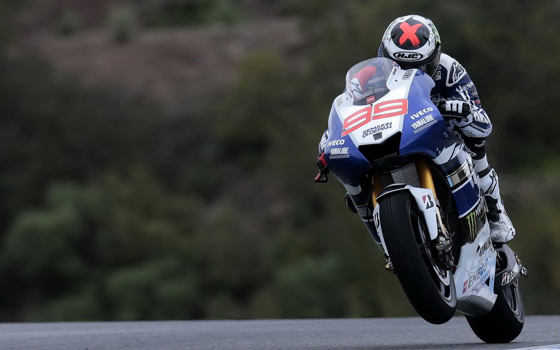 Jorge Lorenzo number 99, Yamaha YZR-M1 MotoGP bike, Wheelie out of corner, HD Desktop wallpaper