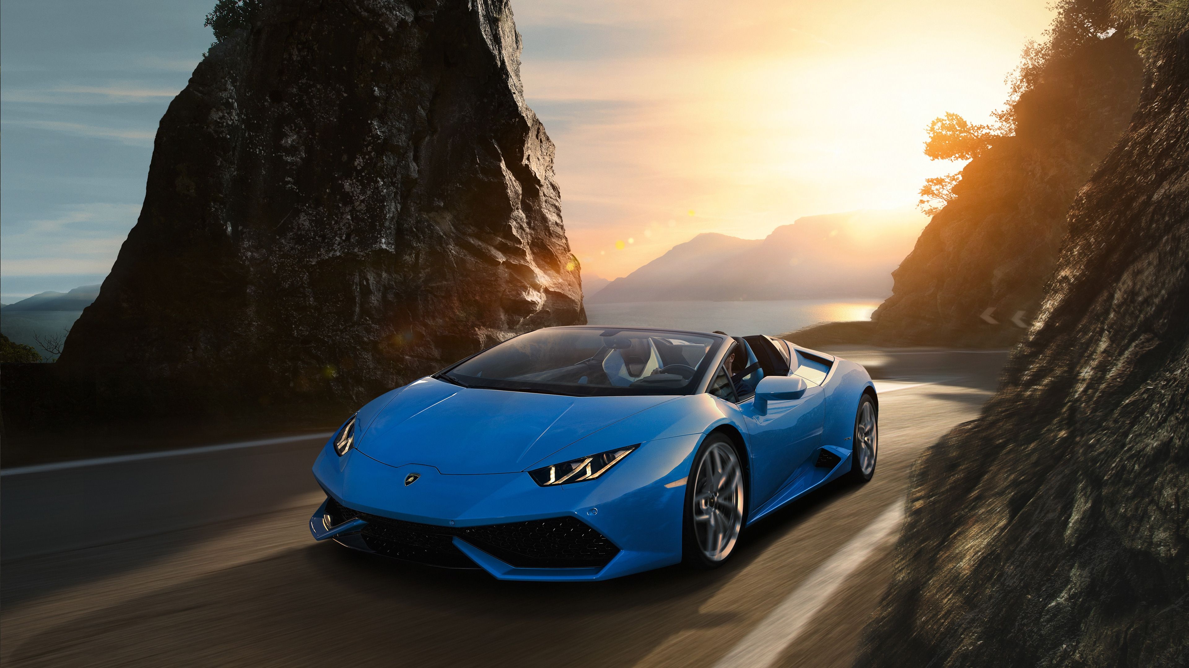 Lamborghini Huracan Spyder, coastal mountain road, golden hour sunset, 4K Desktop wallpaper