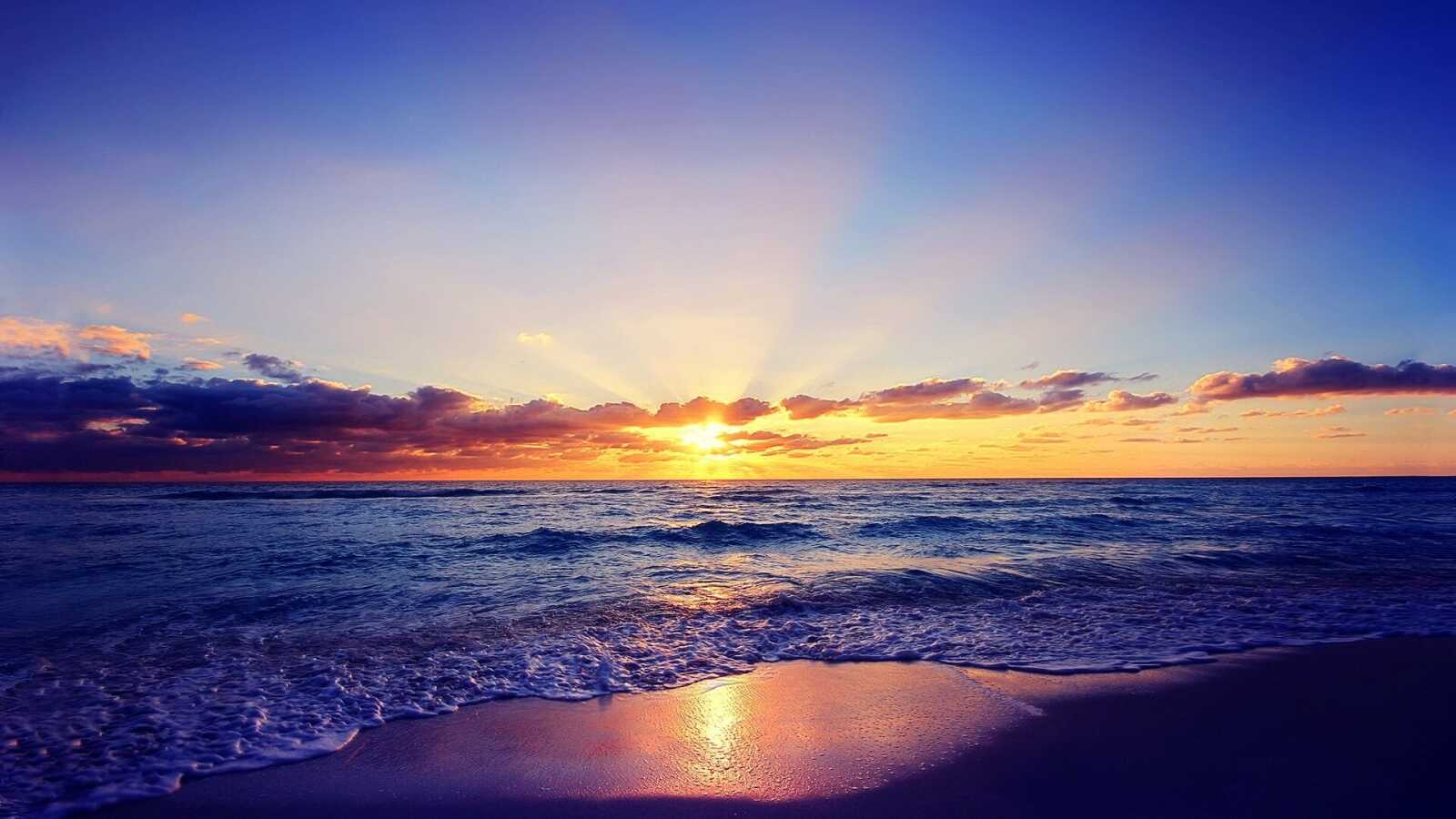 Sunbeams Over Ocean Horizon